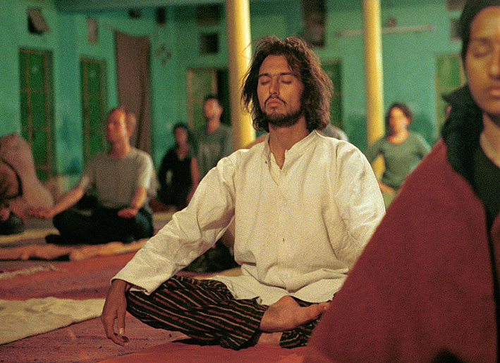 Man with long hair meditating