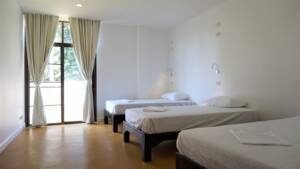 Shared room with three beds