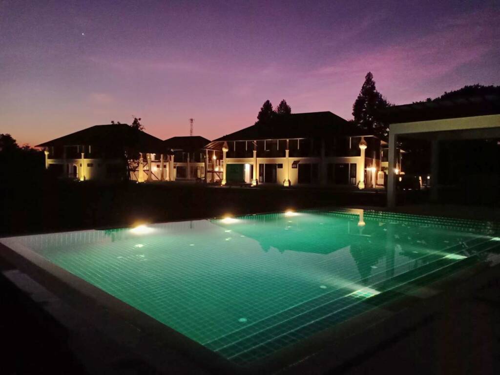 This image has an empty alt attribute; its file name is Ashram-at-night-pool-1024x768.jpg