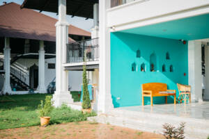 Reception area with bench, garden, and building