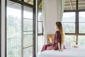 View from deluxe room overlooking lush greenery