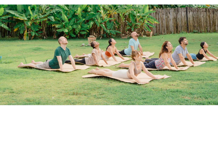 Participants practicing heart-opening asana during a 7 chakras retreat