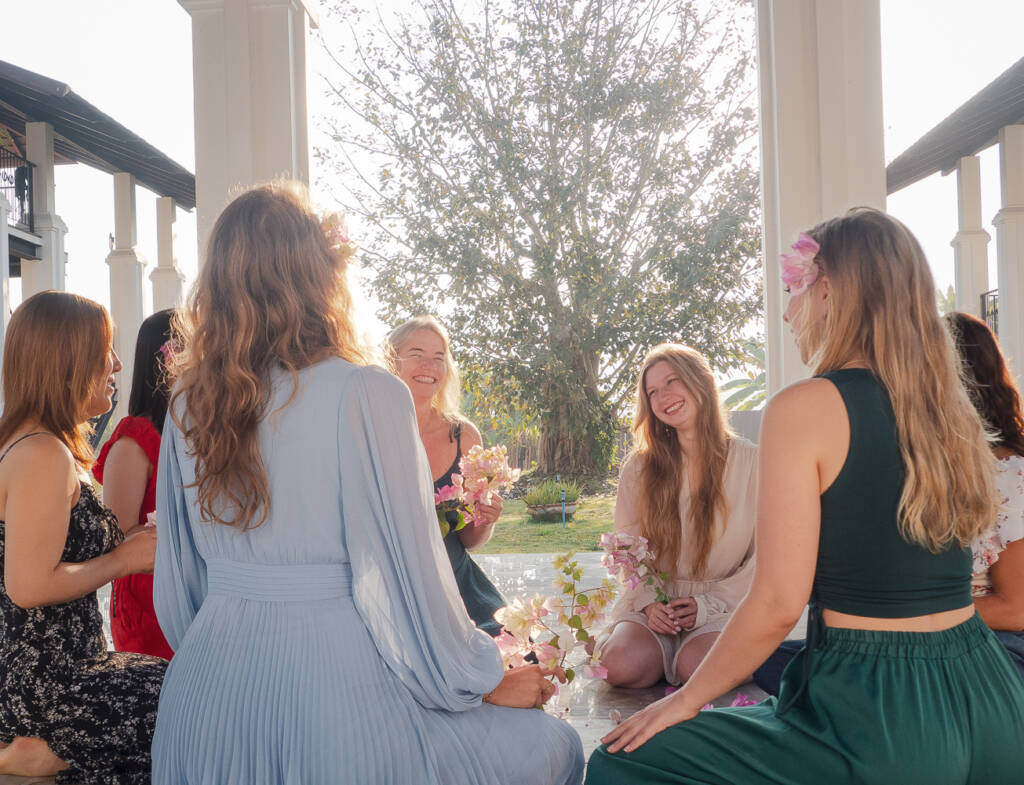 Women gatherin together in a circle