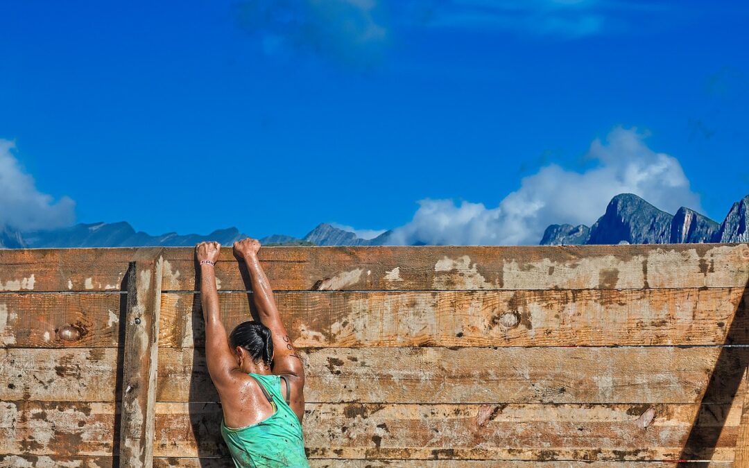 a woman climbing a wall, living with purpose